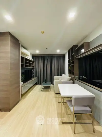 Modern living room with sleek furniture and wooden flooring