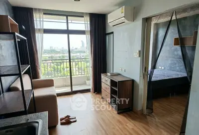 Modern apartment with balcony and city view, featuring stylish living area and cozy bedroom.
