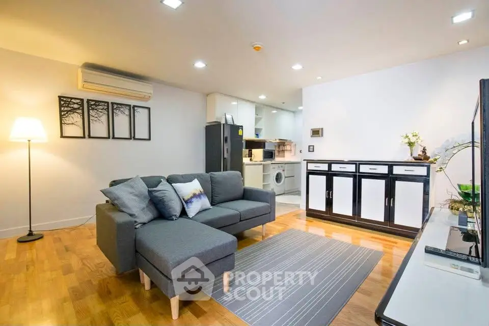 Modern living room with stylish decor and open kitchen layout