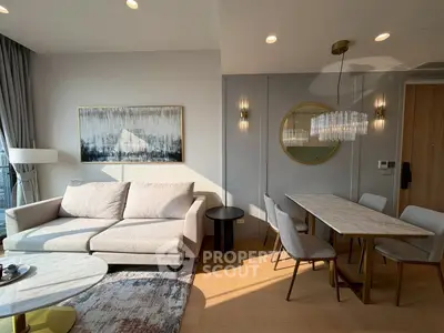 Modern living room with elegant dining area and stylish decor