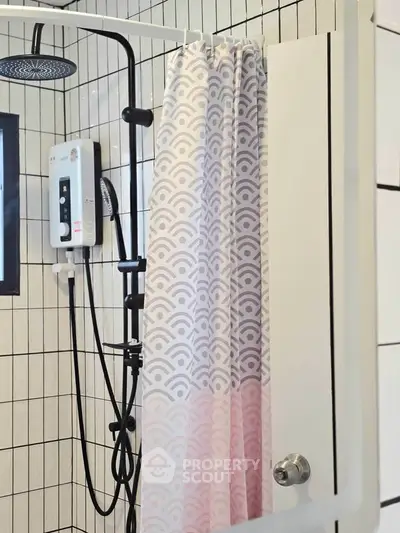 Modern bathroom with stylish shower and patterned curtain in contemporary home.