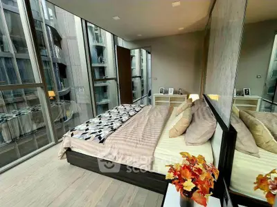 Luxurious modern bedroom with floor-to-ceiling windows and elegant decor