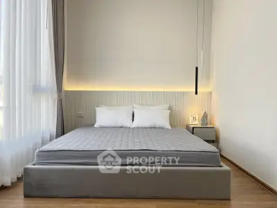 Modern bedroom with elegant design and cozy lighting, featuring a comfortable bed and stylish decor.