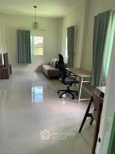 Spacious living room with modern furniture and natural light