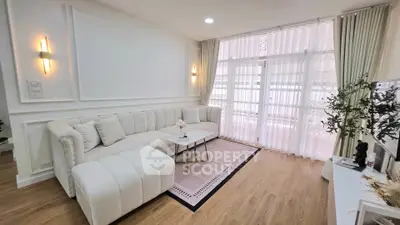 Elegant living room with plush sofa and natural light