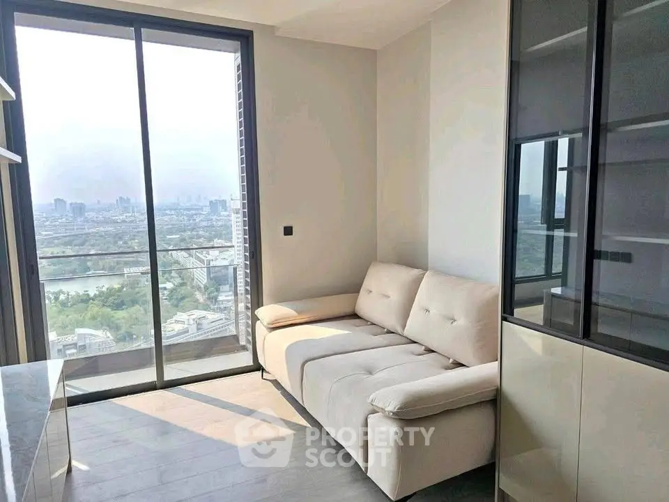 Modern living room with stunning city view and cozy sofa in high-rise apartment