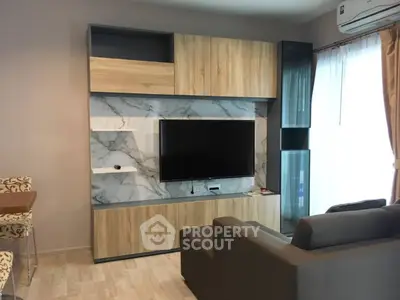 Modern living room with stylish TV unit and cozy sofa