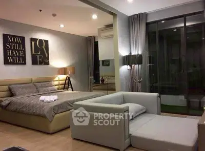 Modern bedroom with stylish decor and cozy seating area