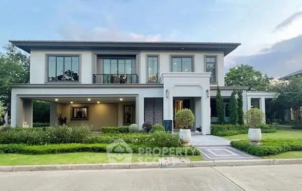 Elegant two-story house with lush garden and modern facade