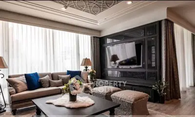 Luxurious living room with elegant decor, large windows, and stylish furniture, perfect for modern living.