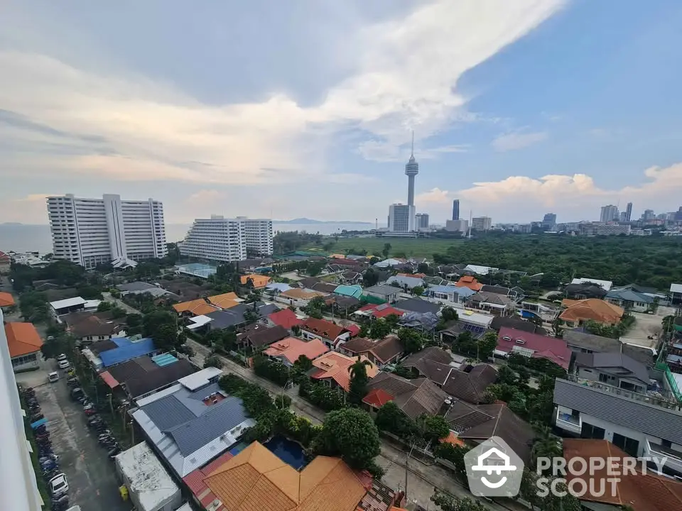 Stunning cityscape view with diverse architecture and iconic tower in the background