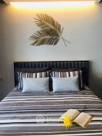Stylish bedroom with modern decor and cozy bedding, perfect for relaxation.