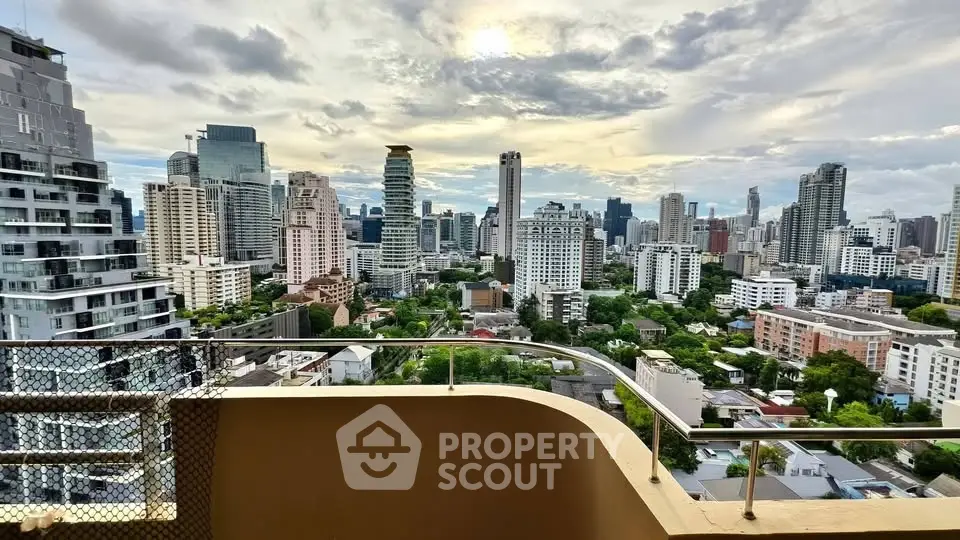 Stunning cityscape view from a high-rise balcony overlooking urban skyline.