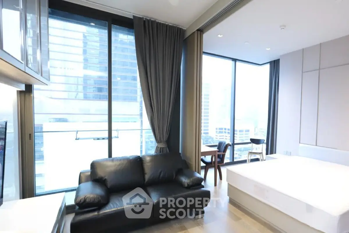 Luxurious modern living room with floor-to-ceiling windows and stunning city view