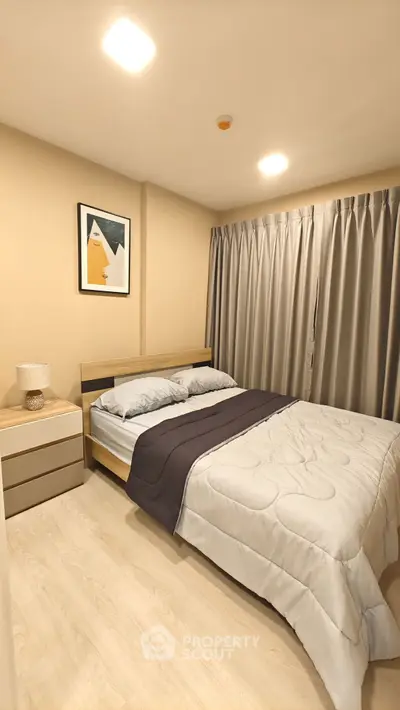 Cozy modern bedroom with stylish decor and soft lighting