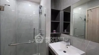 Modern bathroom with sleek design and glass shower enclosure