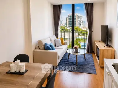Modern living room with city view, stylish furniture, and natural light.