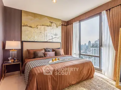 Luxurious bedroom with stunning city view and elegant decor in high-rise apartment.
