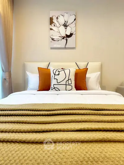 Elegant bedroom with stylish decor and cozy bedding, perfect for relaxation.