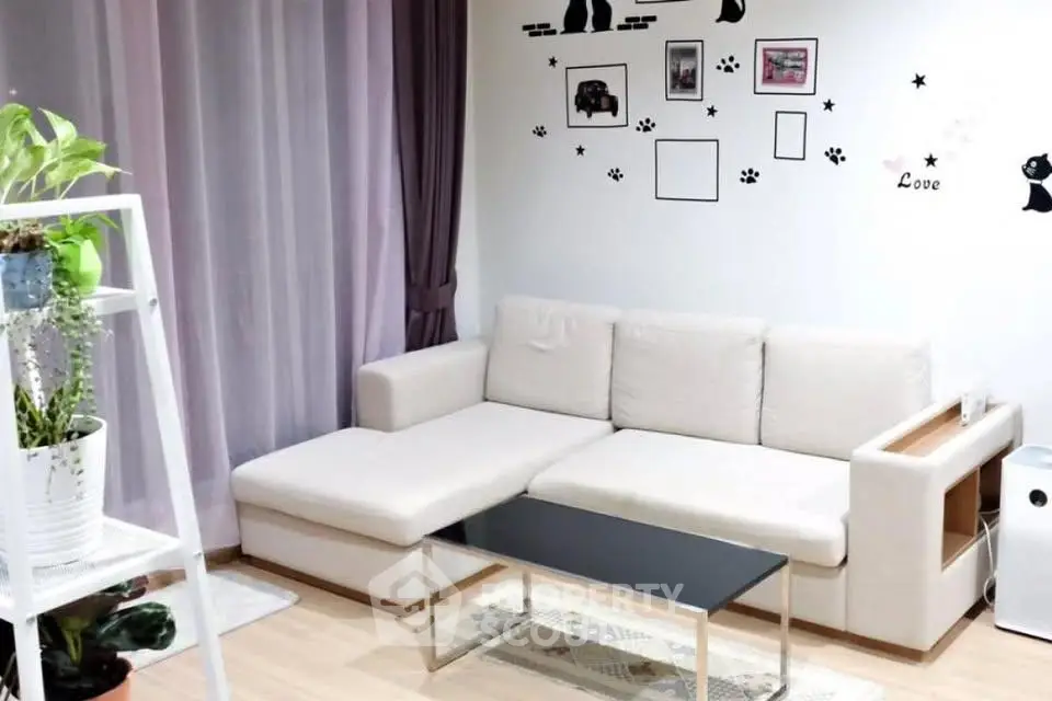 Modern living room with white sectional sofa and stylish decor