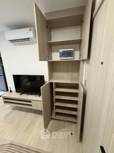 Modern living room with built-in storage and sleek entertainment center