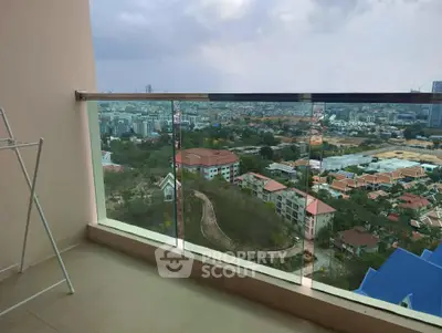 Stunning balcony view overlooking cityscape with modern glass railing and expansive skyline.