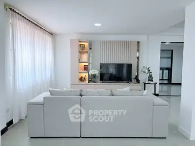 Modern living room with sleek design and cozy sofa, perfect for relaxation and entertainment.