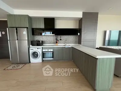 Modern kitchen with sleek appliances and open layout in stylish apartment