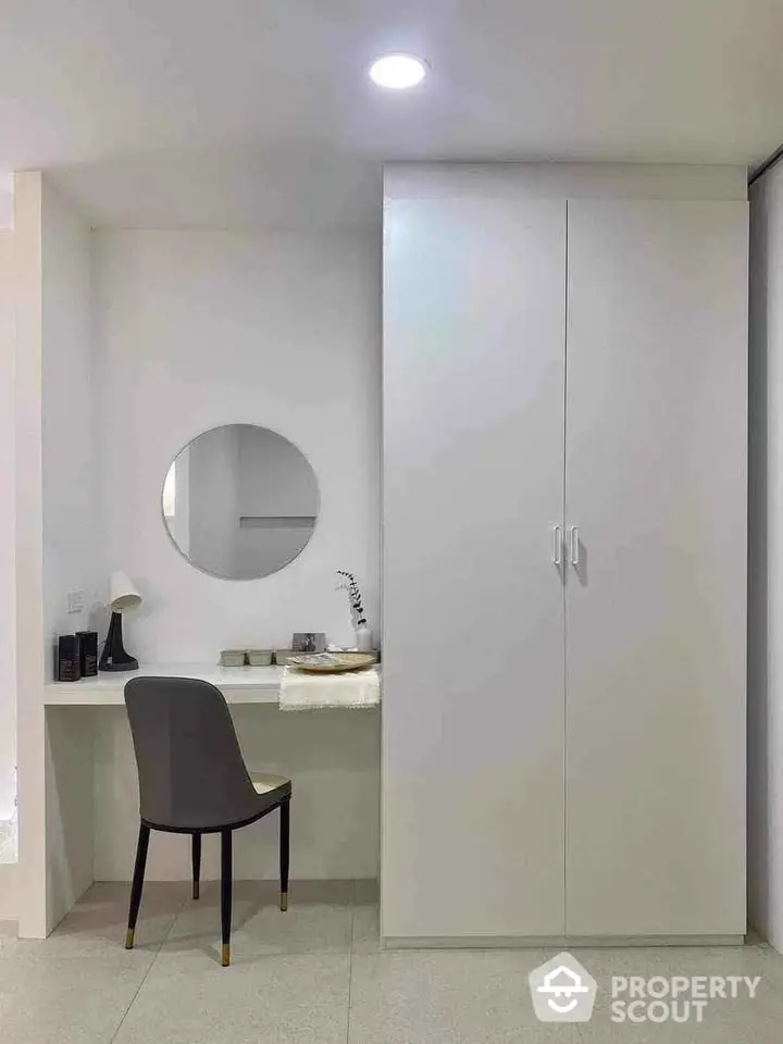 Minimalist bedroom with sleek wardrobe and stylish vanity area