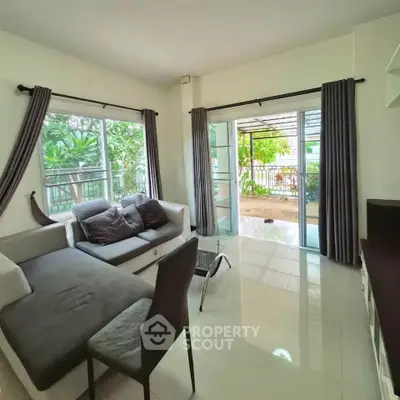 Spacious living room with garden view and modern decor