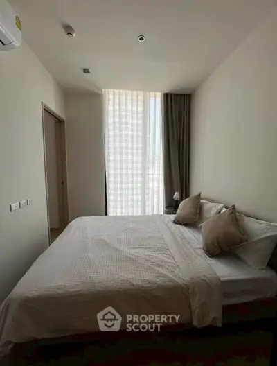 Cozy bedroom with natural light and minimalist decor