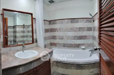 Elegant bathroom with marble tiles and modern fixtures