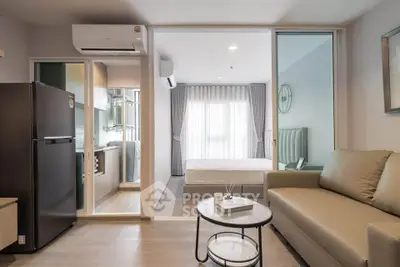 Modern studio apartment with open layout, featuring a cozy living area, sleek kitchen, and bright bedroom.