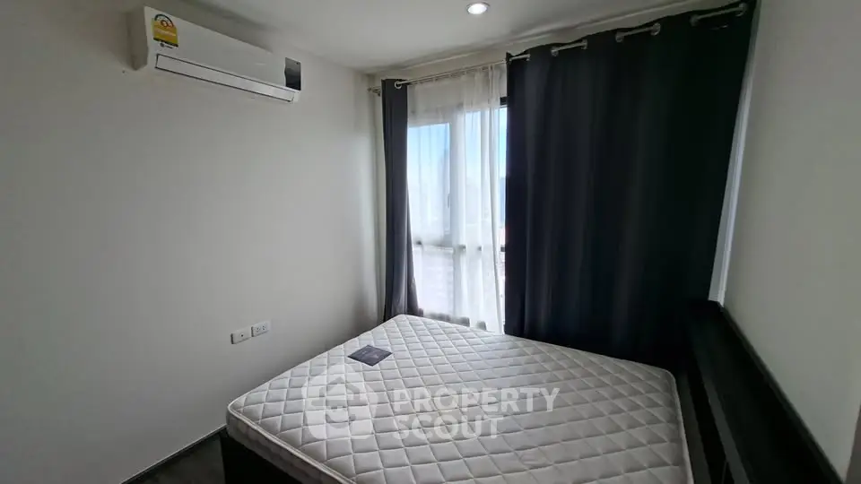 Cozy bedroom with natural light and air conditioning in modern apartment