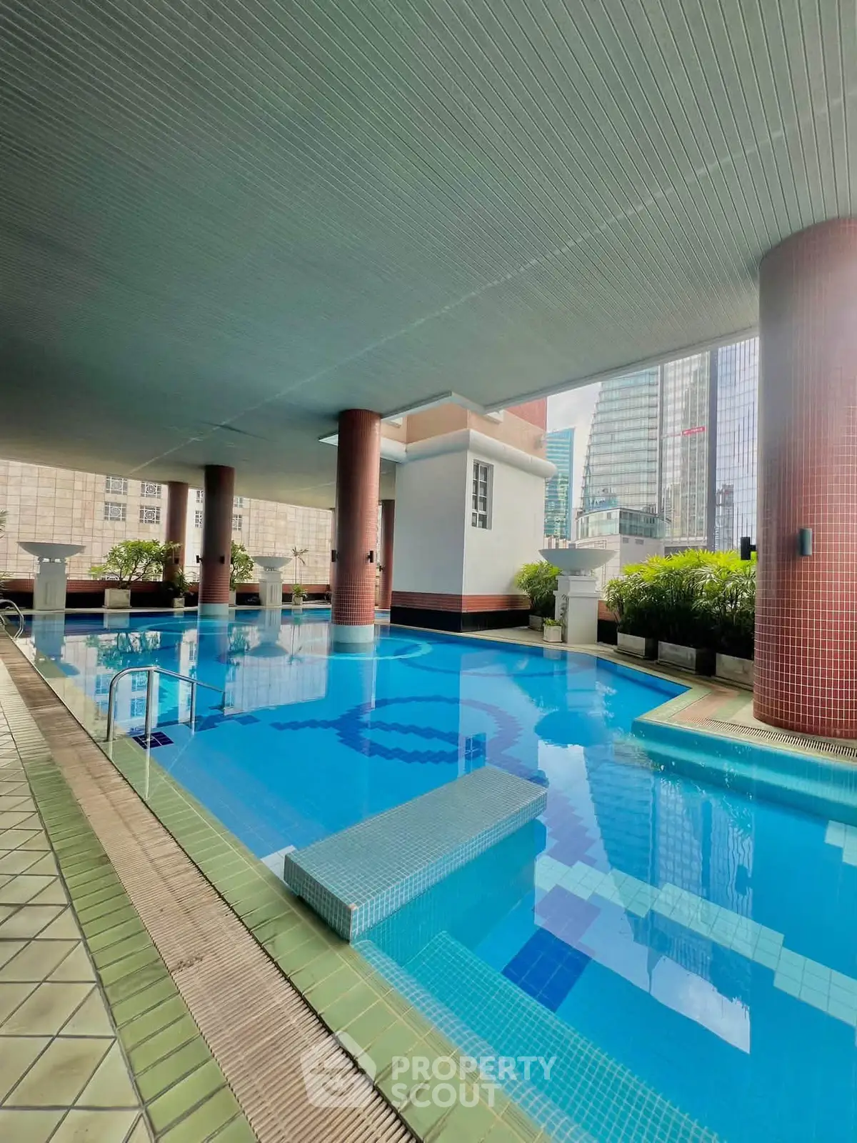 Luxurious indoor pool area with modern design in high-rise building
