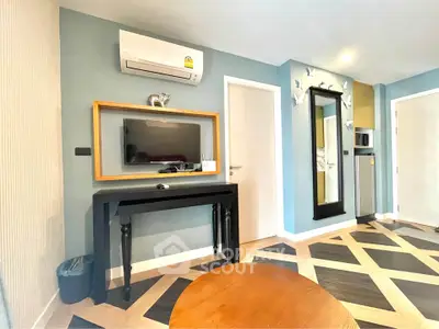 Modern living room with stylish decor and air conditioning
