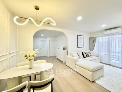 Modern living room with elegant lighting and cozy seating area