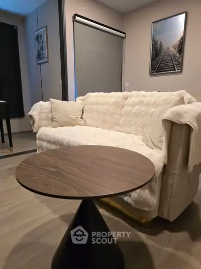 Cozy living room with plush sofa and modern round coffee table