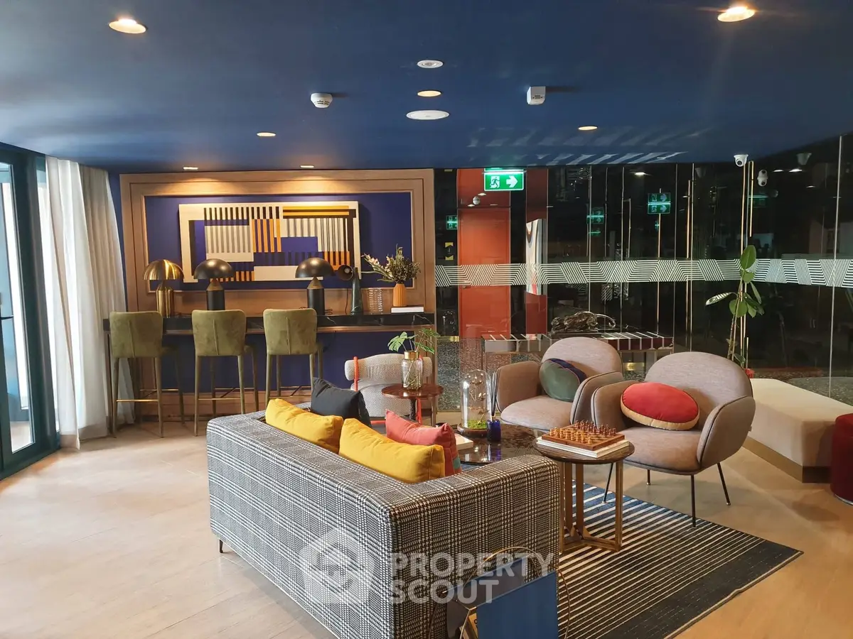 Stylish modern living room with vibrant decor and cozy seating area in luxury apartment.