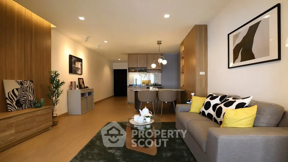 Modern living room with stylish decor and open kitchen layout