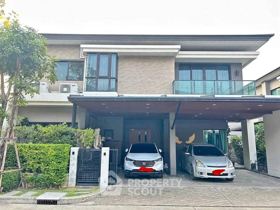 Modern two-story house with spacious driveway and lush greenery