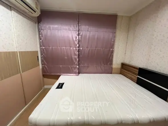 Cozy bedroom with modern design and ample natural light