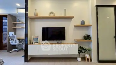 Modern living room with sleek TV setup and stylish decor