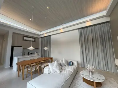 Spacious modern living room with high ceilings and elegant dining area, featuring stylish furniture and natural lighting.