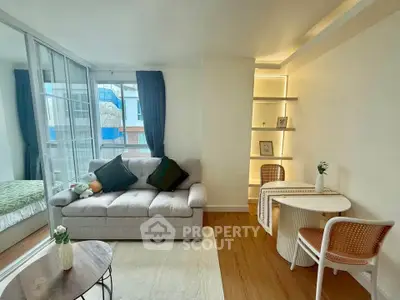 Modern living room with cozy sofa and stylish dining area in bright apartment