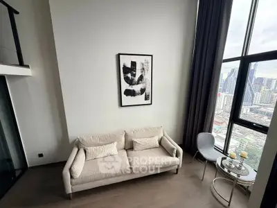 Modern living room with high ceiling and city view from large windows