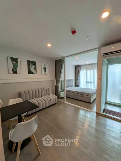 Modern living room with stylish decor and cozy bedroom view