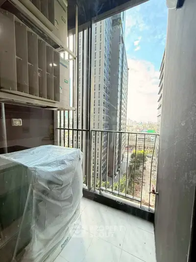 Modern balcony with city view in high-rise apartment, perfect for urban living.