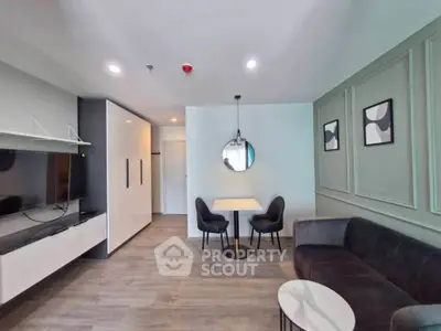 Modern living room with sleek furniture and stylish decor in a contemporary apartment.