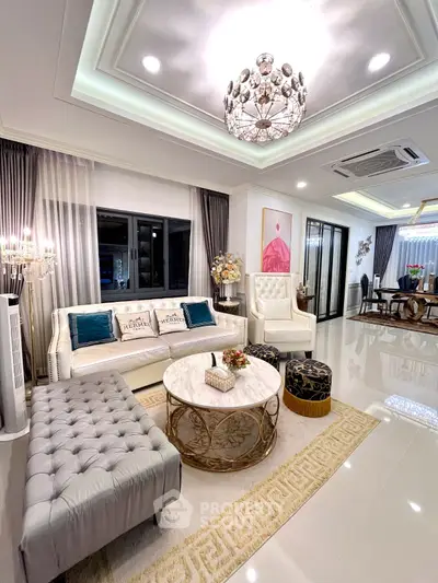 Luxurious living room with elegant decor and chandelier lighting